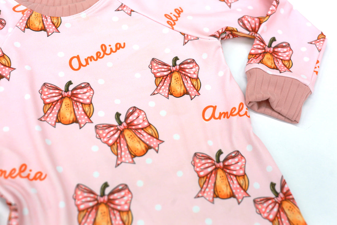 Halloween nightwear for kids with cartoon pumpkins and pink bows
