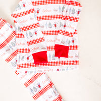 personalized Modern Nutcracker Ballet for little boys with minimalistic images from the Nutcracker Ballet and his name with red checkered stripe pattern on white background and red cuffs.