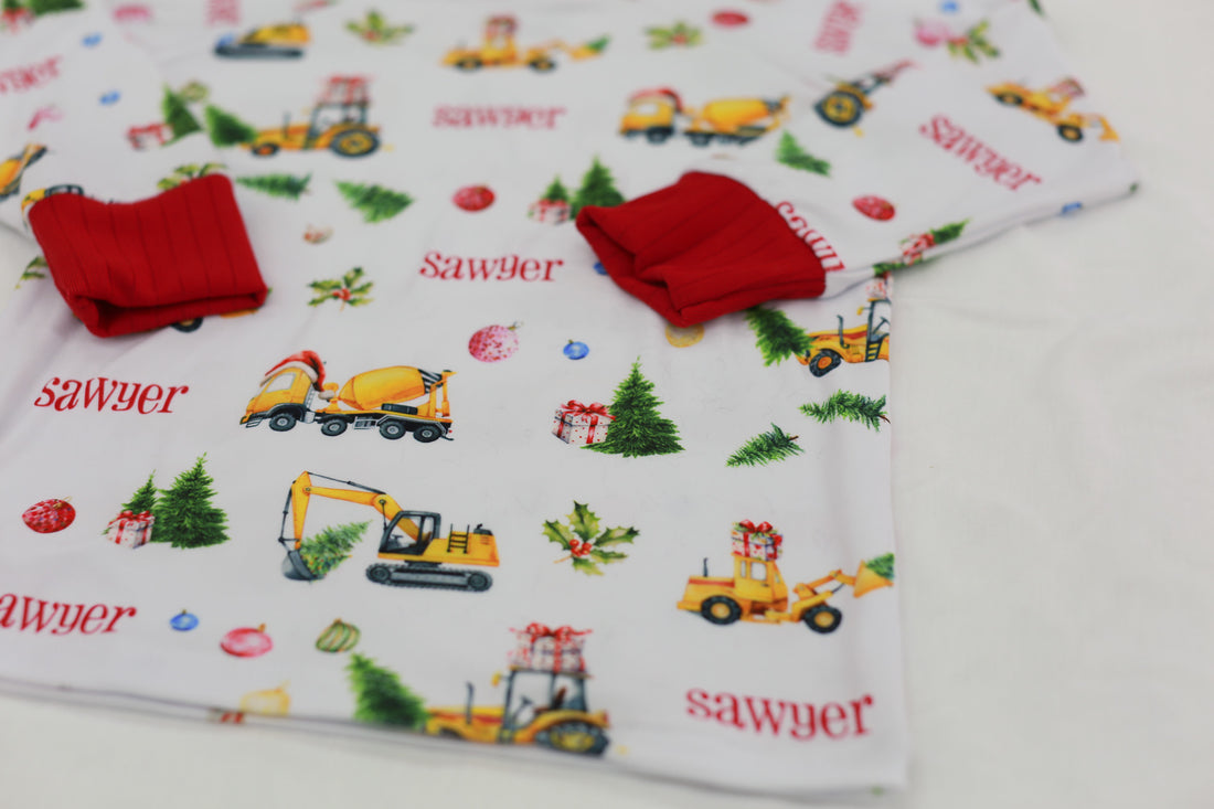Close up photo of Construction Christmas Pajamas to show durability.