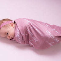 Baby swaddle Personalized swaddle Stretchy fabric Baby shower gift Minimalist design Solid color Nursery decor Newborn essential Breathable material Coordinating prints Soft touch Comfortable sleep Custom baby blanket