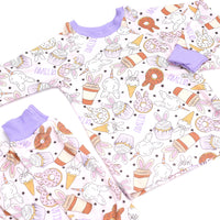 cute easter sleepwear for kids, girl Easter pajamas with bunny shaped sweet treats on a lavender stretchy background.