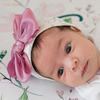 Personalized newborn outfit set with Wildflowers floral design and satin bow hat