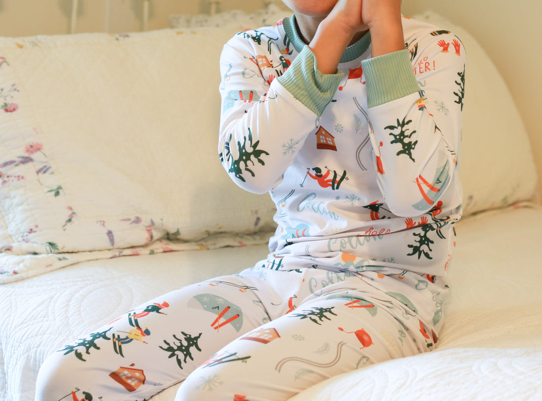 Young child wearing Ski Pajamas.