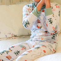 Young child wearing Ski Pajamas.