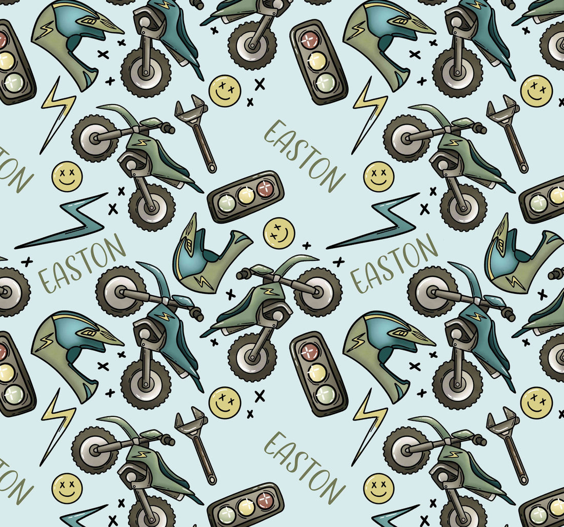 The design on our dirt bike pajamas that includes dirt bikes, dirt bike helmets, smiley faces, and stop lights.