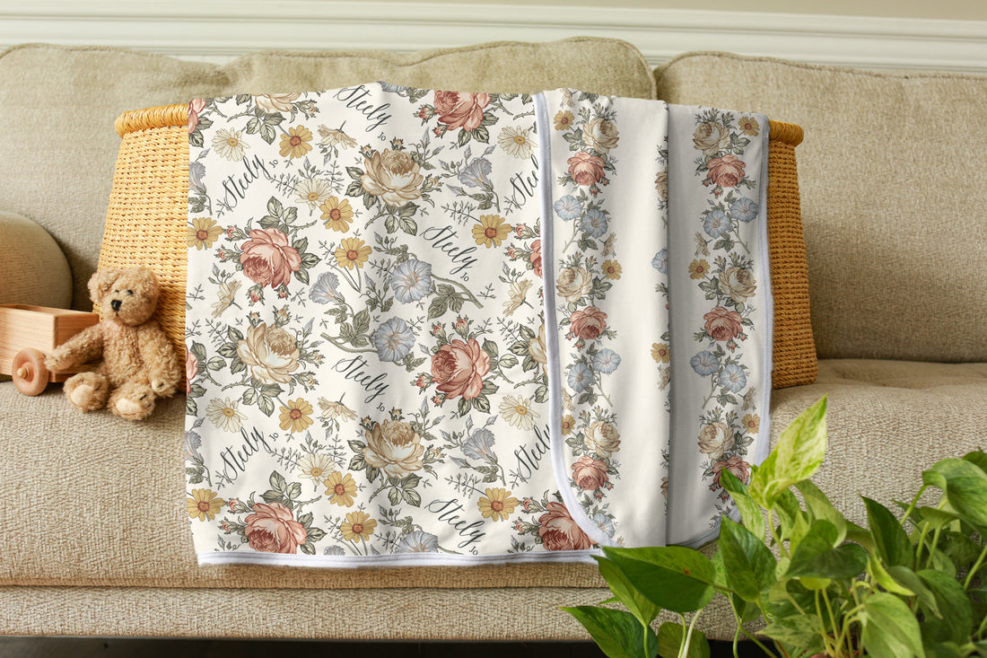Floral patterned blanket for baby girl personalized with her name. Two sided print