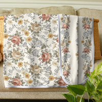 Floral patterned blanket for baby girl personalized with her name. Two sided print