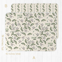 Two placemats with fishing-themed pattern and baby's name on a white background.