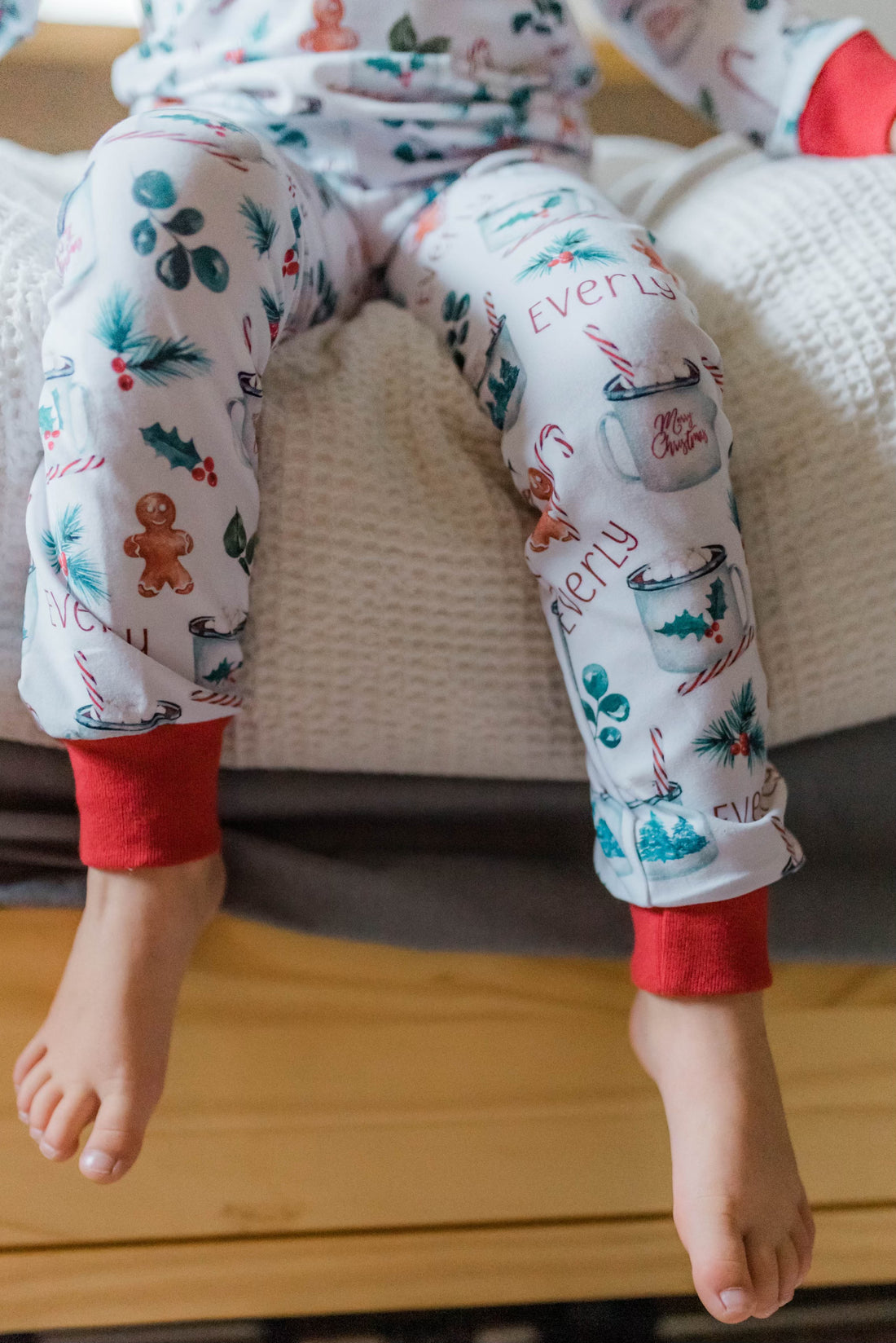 Picture of the bottoms of hot cocoa christmas pajamas.