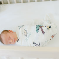 Baby Boy sleeping in a Winnie The Pooh Swaddle Blankets
