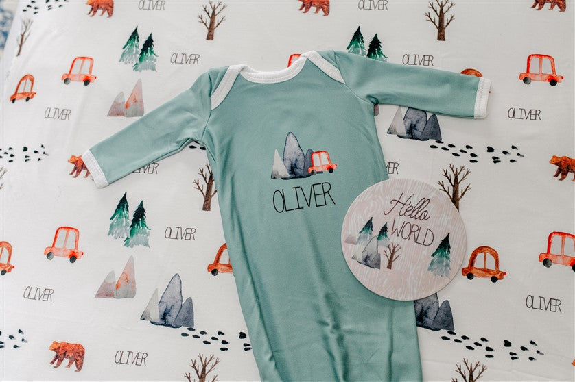 The Great Outdoors Baby Infant Gown Tie bottom gown that is personalized. Sage Green Baby Gown with name, mountains, trees, bear.