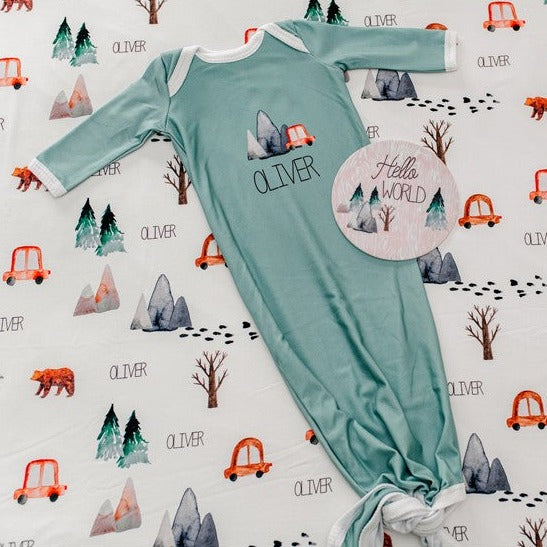 The Great Outdoors Baby Infant Gown Tie bottom gown that is personalized. Sage Green Baby Gown with name, mountains, trees, bear.