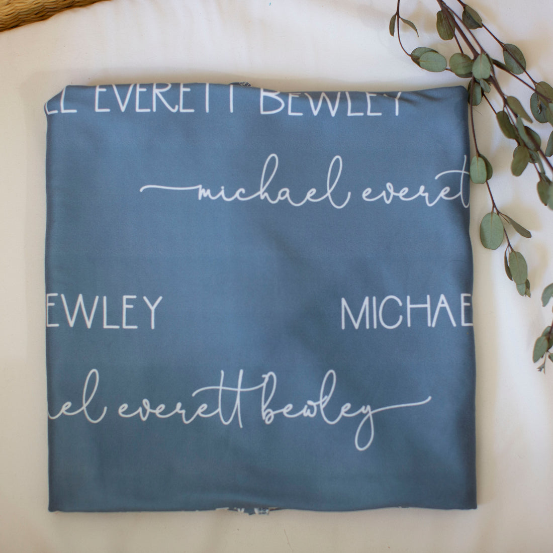 The beautiful design on the camden smokey blue swaddle blanket.
