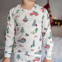 little boy wearing personalized Christmas Truck PJ's, nostalgic baby Christmas sleepwear.