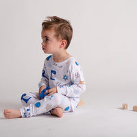 Child wearing personalized kids Hanukkah pajamas to celebrate Hanukkah.