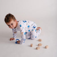 Child crawling while wearing Kids Hanukkah Pajamas.