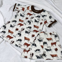 Our personalized cow pajamas top and shorts. The pajama top and shorts have a matching design with three different colored cows.