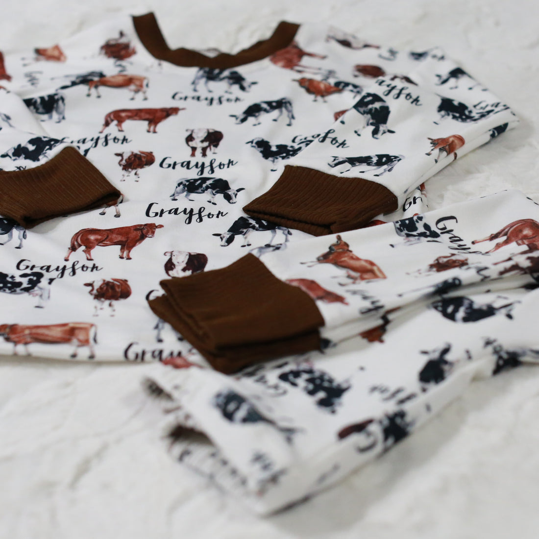 The design on our toddler cow pajamas The pajamas are personalized with a child's name to create a memorable keepsake for years to come.