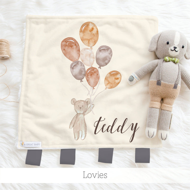 Lovies are small minky fur squares with ribbon tabs made with your child's name in them. they make wonderful custom baby shower gifts
