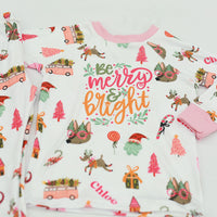 Merry & Bright colorful christmas jammies, with pink and green cartoon Holiday images such as trees, lollipops, Santa faces, candy canes and reindeer.