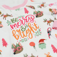 Merry & Bright colorful christmas jammies, with pink and green cartoon Holiday images such as trees, lollipops, Santa faces, candy canes and reindeer.