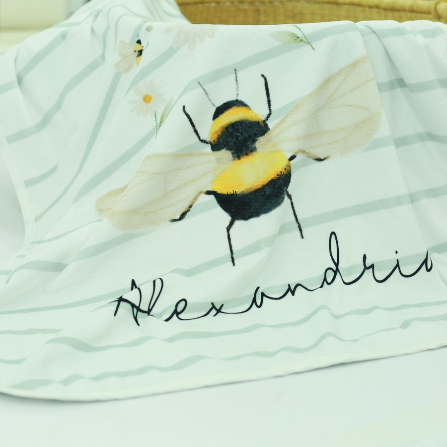 bumblebee blanket for babies, personalized stroller blanket with baby's name and bumblee print on striped background