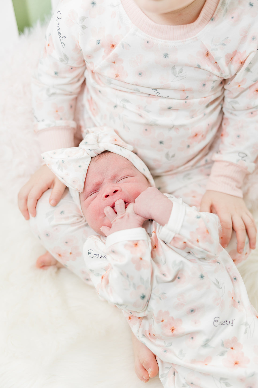 baby girl in peach blossom baby gown and matching headband, easy on and off outfit for newborn baby girl, personalized with baby's name and soft pink floral print