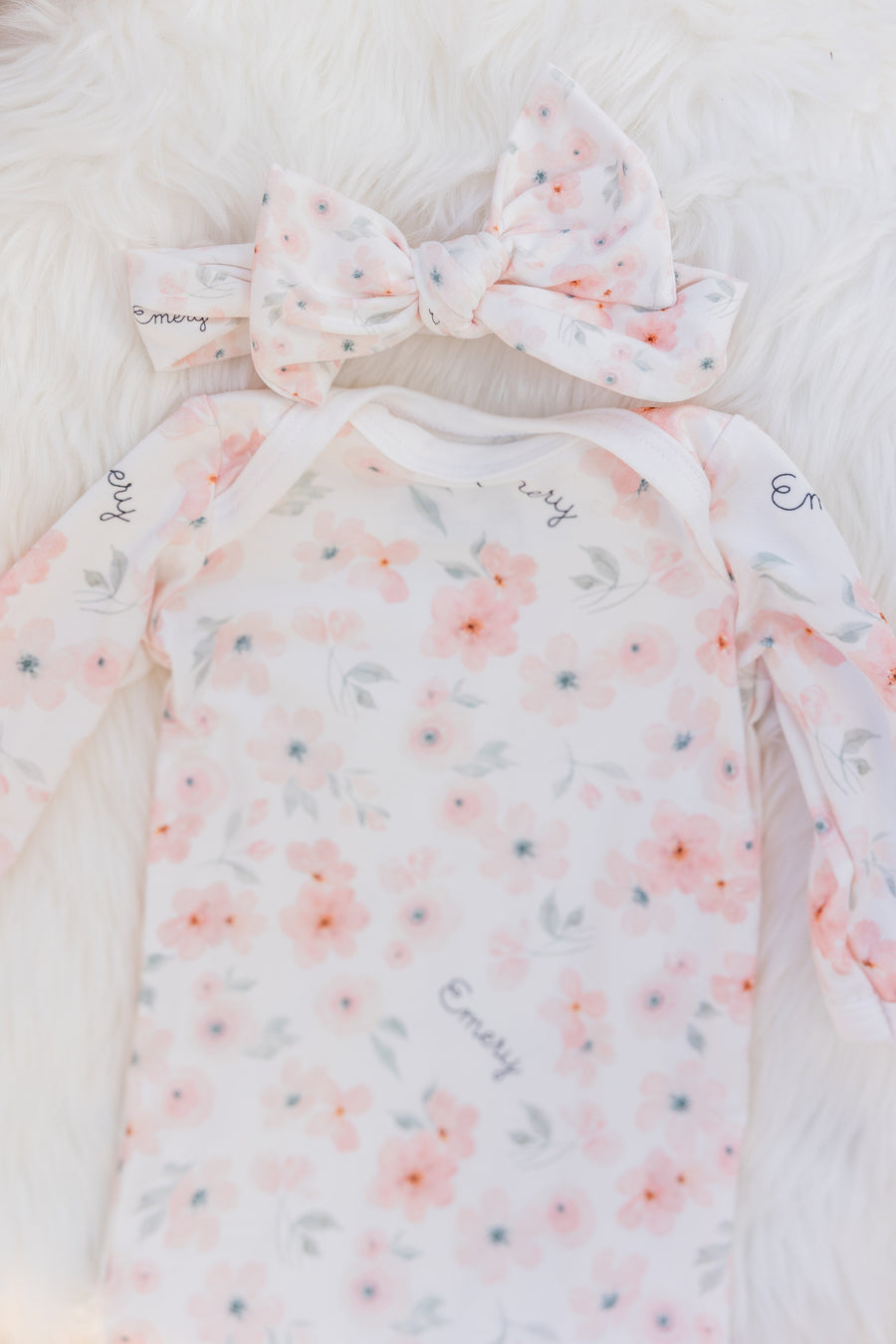 baby girl in peach blossom baby gown and matching headband, easy on and off outfit for newborn baby girl, personalized with baby's name and soft pink floral print