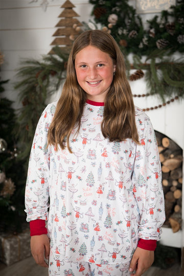 Teen girl wearing Modern Nutcracker Holiday Pajamas for women, modern minimalistic images from the Nutcracker ballet on white knit fabric and red cuffs, matching Christmas jammies for families.