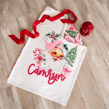 Minky fabric Christmas pillowcase for girls with vintage Santa face and pink accents and kid's name in red script font.