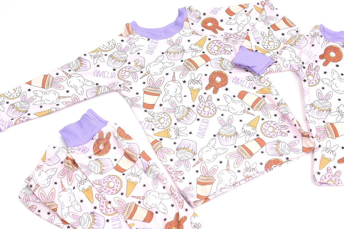 cute easter sleepwear for kids, girl Easter pajamas with bunny shaped sweet treats on a lavender stretchy background. 