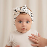 Personalized Baby Swaddle | Soft Stretchy Newborn Swaddling Wrap with Black Bows