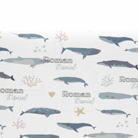 a repeating pattern of cartoon-style illustrations of various marine animals, including sharks, dolphins, and other sea creatures, along with the names "Roman" and "Daniel" written below each illustration.