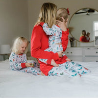 Mother and children wearing matching Hot Cocoa Christmas Pajamas