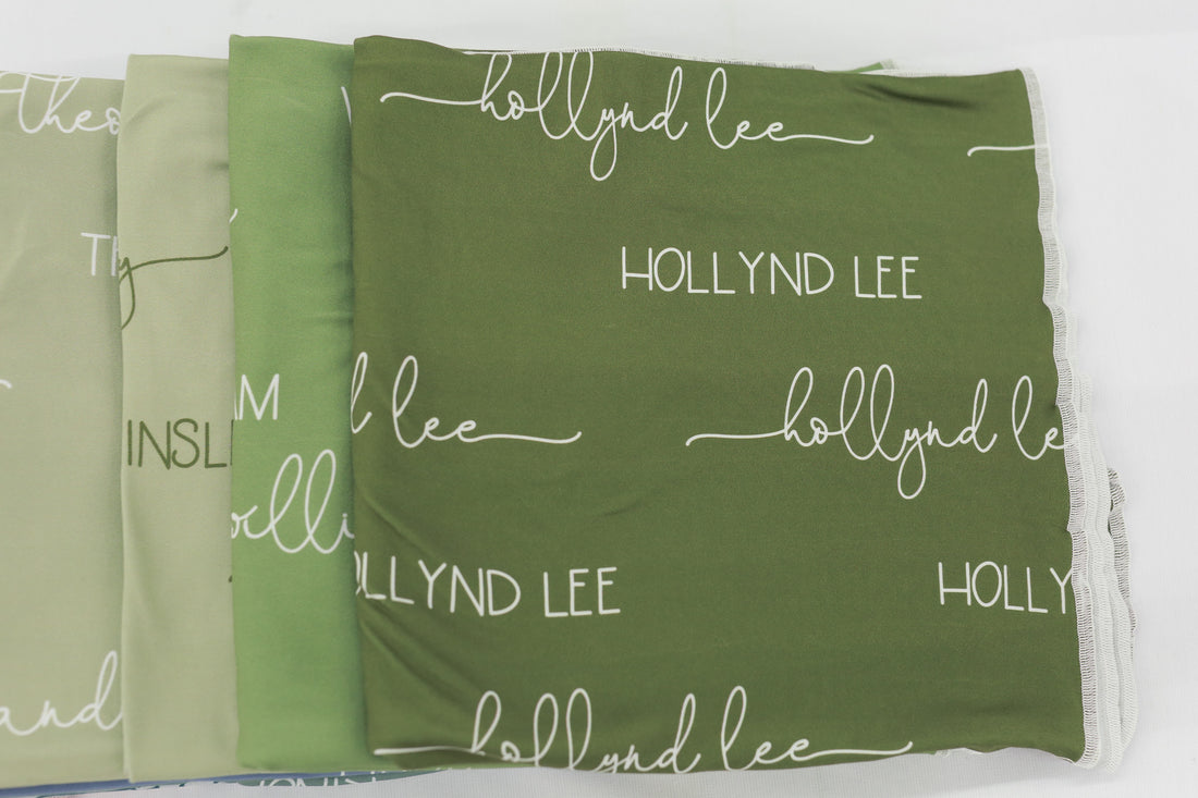 The fonts on our personalized camden olive swaddle blankets. 