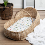 Personalized bassinet sheet with Peter Rabbit images and baby's name on mini crib mattress.