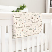 gender neutral woodland animal satin bound baby blanket personalized with babys name on an ivory background