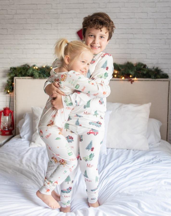 little boy wearing personalized Christmas Truck PJ's, nostalgic baby Christmas sleepwear.