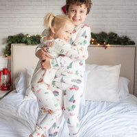 little boy wearing personalized Christmas Truck PJ's, nostalgic baby Christmas sleepwear.